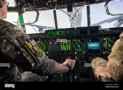 Flight crew in the cockpit of a US Air Force MC-130J Commando II from the 352nd Special ...