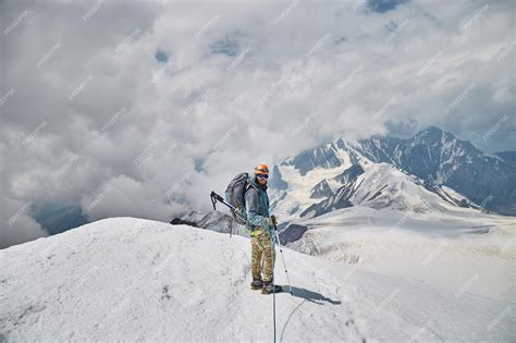 Premium Photo | Climbing Kazbek Georgia male climber standing on the ...