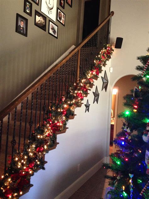 Love the garland at bottom of banister to keep hand rail free for kids and gu… | Escalera de ...