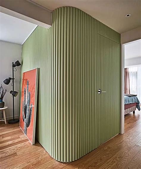 the green curved walls in this seoul house feature hidden storage, by daniel valle architects ...