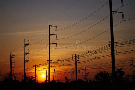 The Electric Poles and Electric Lines with a Sky of Sunset Stock Photo ...