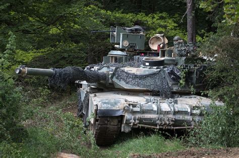 An Army M1A1 Abrams tank crew provides security during Combined Resolve ...