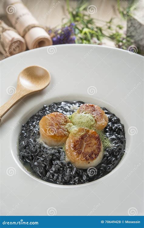 Scallop squid ink risotto stock photo. Image of rice - 70649428