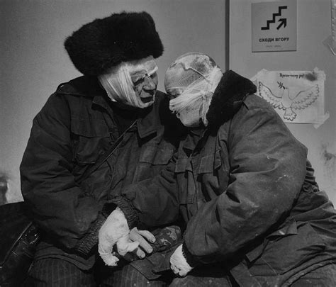 A couple comforts each other at the hospital after a Russian missile ...