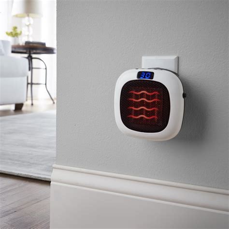 The 750 Watt Wall Outlet Heater - Hammacher Schlemmer | Wall outlets ...