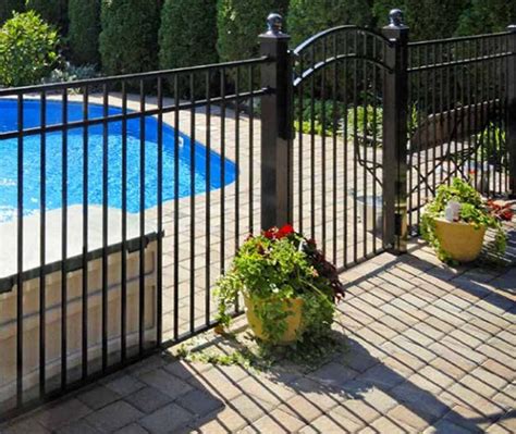 Aluminum pool fences are affordable and good looking. A black metal pool fence… | Backyard pool ...