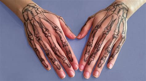 20 Cool Skeleton Hand Tattoo Ideas & Meaning - The Trend Spotter