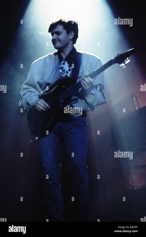 Charlie Burchill guitarist with Simple Minds on stage in Rome Stock Photo - Alamy