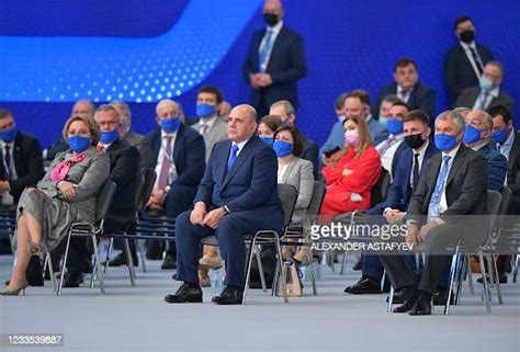 Russian Prime Minister Mikhail Mishustin listens to speeches during ...