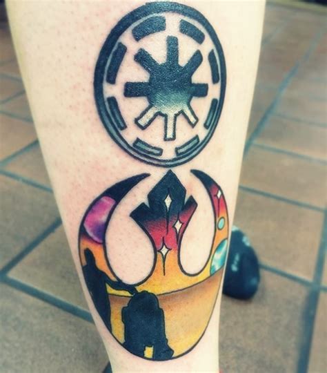 Simple black ink Empire emblem tattoo on leg with Rebel emblem - Tattooimages.biz