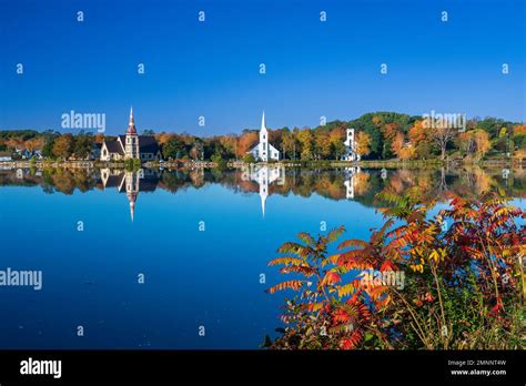 Reflections of churches with fall foliage color in Mahone Bay, Nova ...