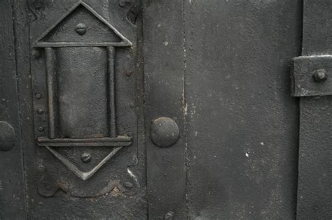 Old black metal door closeup free texture – TexturePalace.com