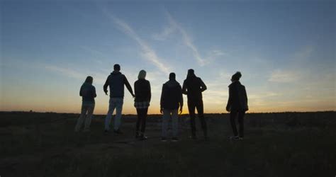 Friends Walking Together Into the Setting Sun, Stock Footage | VideoHive