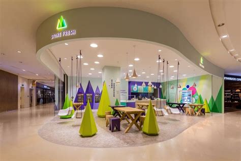 A playful theme of abstract trees and mountains were designed for this frozen yogurt shop ...