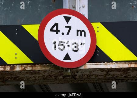 UK bridge clearance height warning sign. Low bridge concept, red triangle warning signs, UK road ...