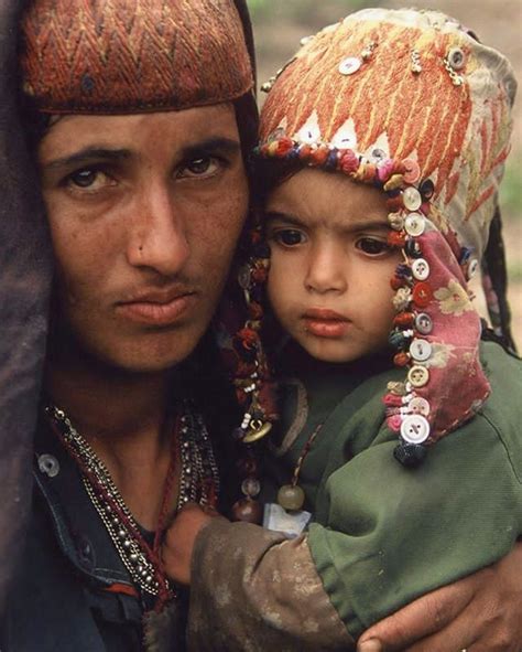 Portrait of a Gujjar-Bakharwal mother and child from a tribe of nomadic ...