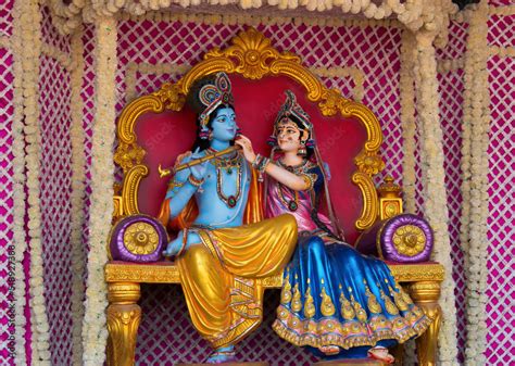 Colorful life size idols of Krishna, Radha sitting at Prem Mandir temple. Happy Krishna ...