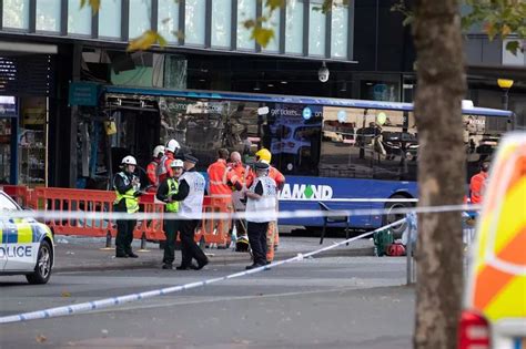 Manchester bus crash driver, 64, arrested as woman fights for her life ...