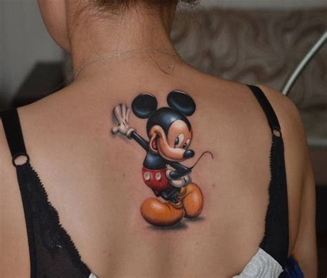 Realistic Mickey Mouse tattoo on the girl’s upper back | Mickey mouse tattoos, Mouse tattoos ...