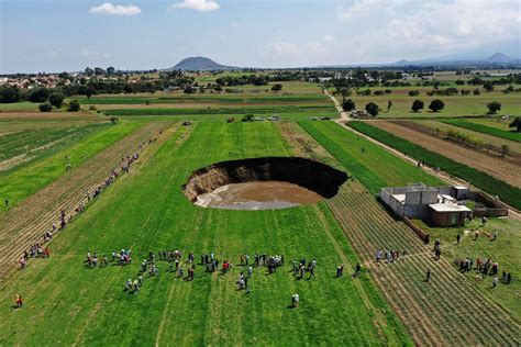 Giant Sinkhole Opens at School’s Football Stadium Picture | Incredible sinkholes around the ...