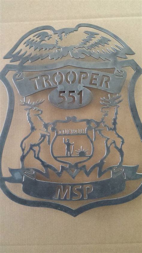 Custom Michigan Police badge with your number and city on Etsy, $110.00