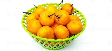 Jeruk Santang Madu. Citrus sinensis. Served in green basket on white ...