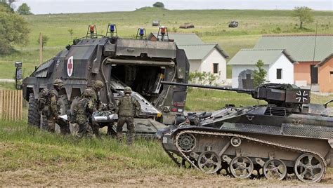 A Wiesel, at right, with a 20-millimeter cannon. Bundeswehr photo Military Photos, Military Art ...