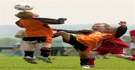 Kid getting kicked in the nuts while headbutting a soccer ball ...