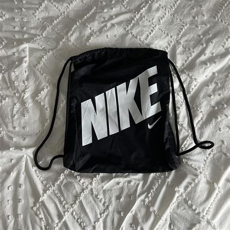 Nike black drawstring bag - Depop