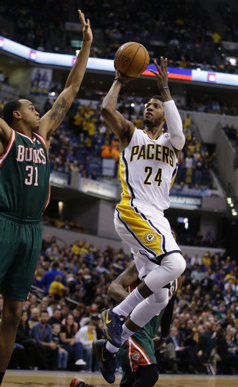 the pacers are playing basketball against the bucks