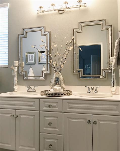I get so many questions about this bathroom (paint color is Sterling by Behr and decor/mirrors ...