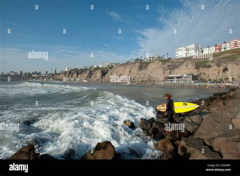 Peru, Lima, Barranco. Surfing on the waves of Costa Verde Stock Photo ...