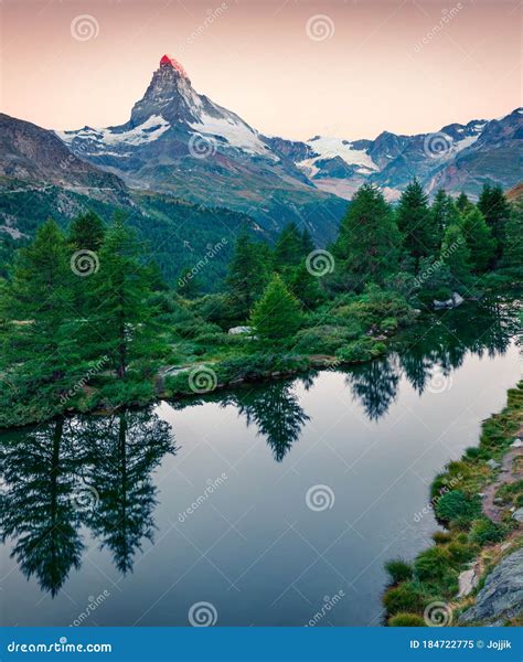 Great Morning View of Grindjisee Lake. Fantastic Summer Sunrise with Matterhorn Monte Cervino ...