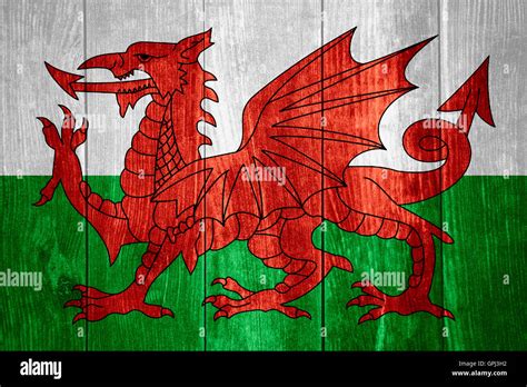 flag of Wales or Welsh banner on wooden background Stock Photo - Alamy