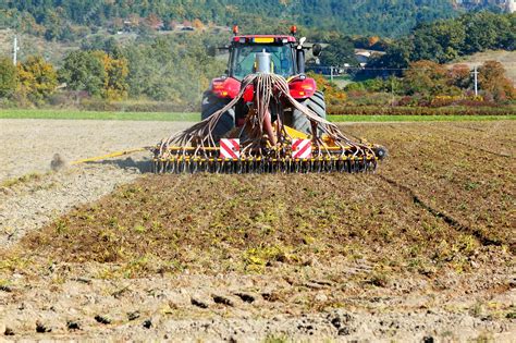 Free Photo | Ploughing heavy tractor during cultivation agriculture works at field with plough