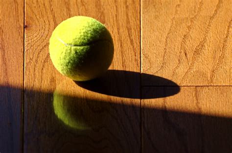 tennis ball on a hardwood floor | theilr | Flickr