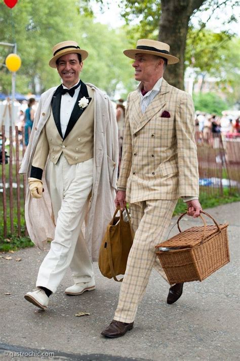 roaring 20s fashion, two smiling men, wearing cream and white 1920s suits, and falttop hats ...