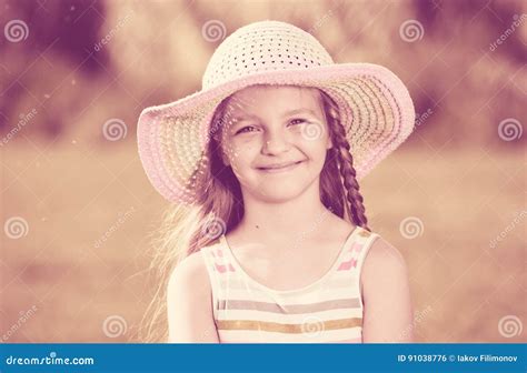 Smiling girl in sun hat stock photo. Image of green, comfortable - 91038776