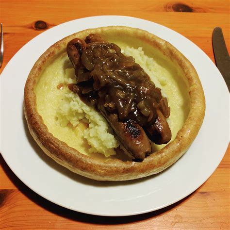 Bangers and mash with onion gravy in a giant Yorkshire pudding. : r/tonightsdinner