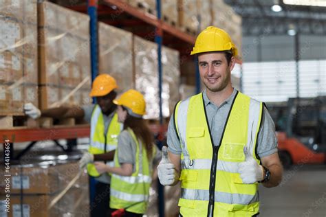 Portrait of male warehouse worker working and wearing safety uniform ...