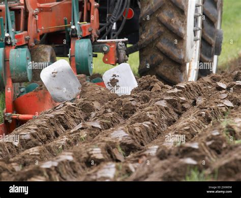 field tractor plough furrow cultivation tillage agriculture farming field farm Stock Photo - Alamy