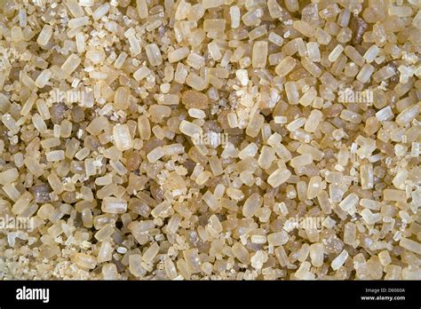 Yellow crystals of cane sugar Stock Photo - Alamy