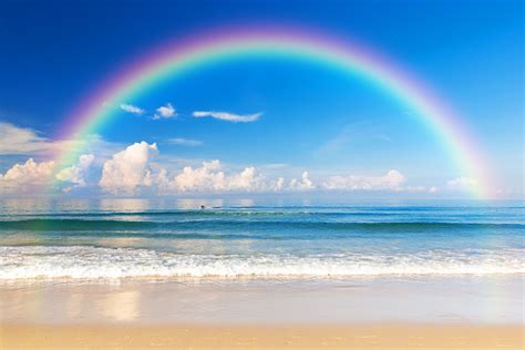 Beautiful Sea With A Rainbow In The Sky Stock Photo - Download Image Now - Rainbow, Sea, Beach ...