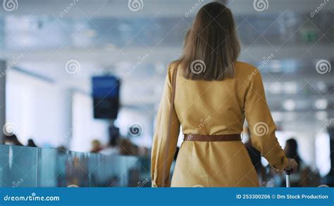 Woman in airport terminal. stock footage. Video of person - 253300206