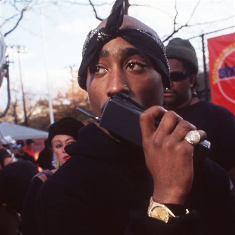 Tupac Holding A Gun