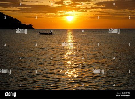 Sunset at Puerto Galera beach in Oriental Mindoro, Philippines Stock ...