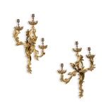 A pair of Louis XV style gilt-bronze three-light wall appliques, 19th ...