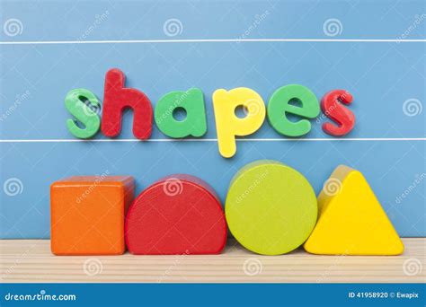 Colorful Magnetic Letter Spelling Shapes. Stock Photo - Image of wooden ...