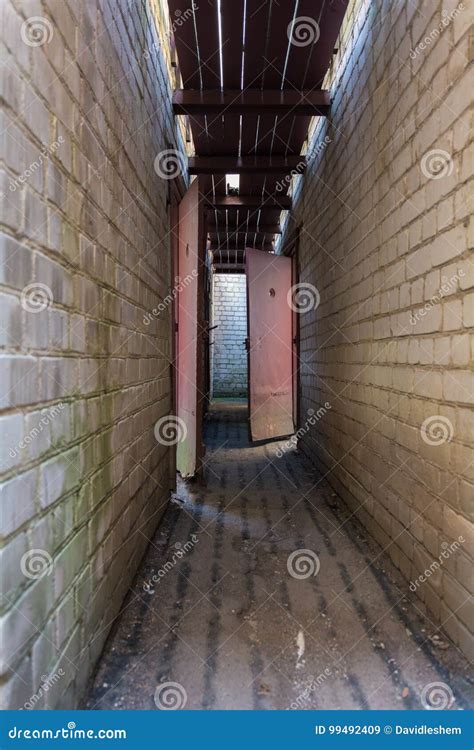 Prison hallway stock image. Image of facility, dark, corridor - 99492409