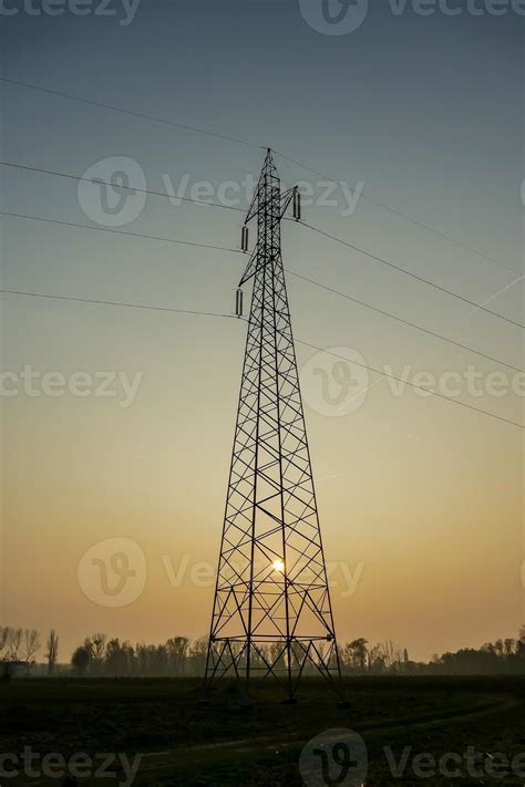 Powerline tower at sunset 14786211 Stock Photo at Vecteezy